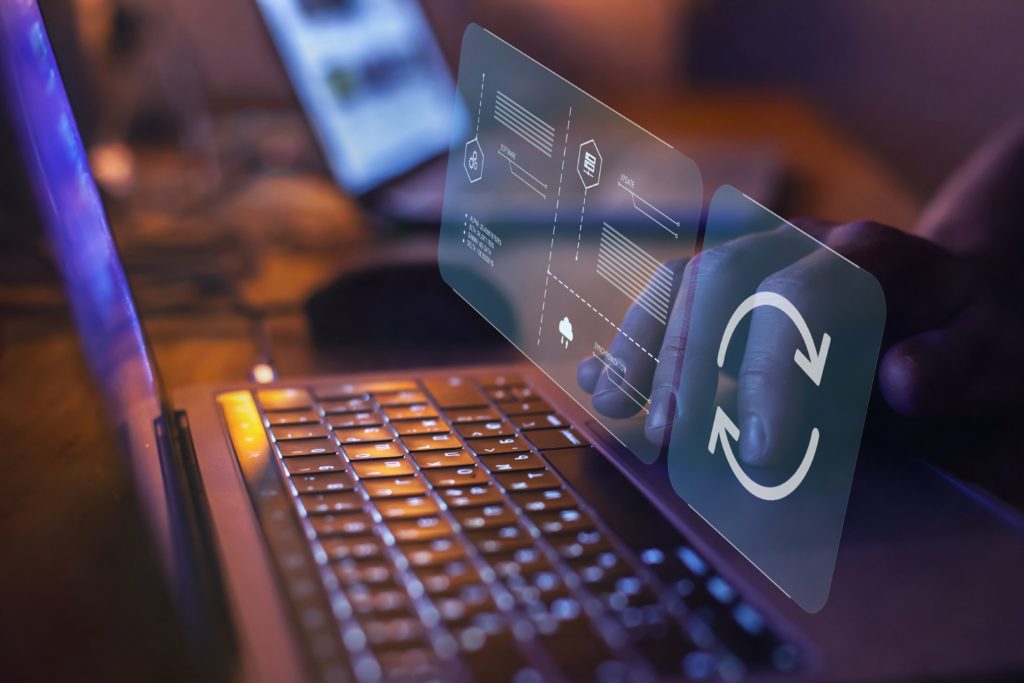 Proactive software updates to avoid issues Hands manage a software update on a business laptop during maintenance.
